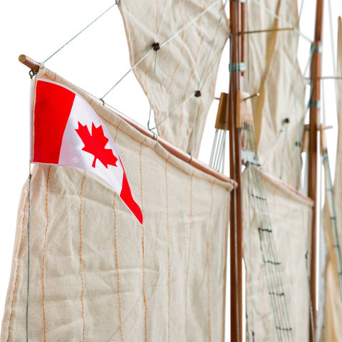 Image of View of the Canadian flag of the Authentic Models Painted Bluenose II Scale Model Sailing Ship AS138